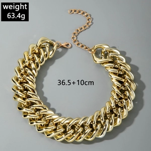 Detailed view of gold chunky Cuban chain link necklace with lobster clasp and extension