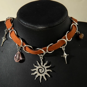 Vintage leather choker with silver sun pendant and pink crystal drop on neck model
