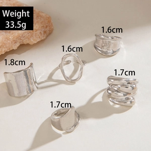 Detail view of 5-piece silver geometric ring set with sizes and 33.5g weight info