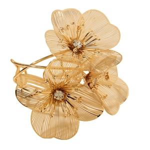Exaggerated gold open bangle with hollow flower patterns and sparkling rhinestone center