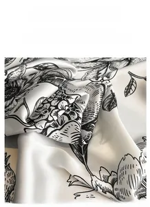 Detail of silk satin square scarf featuring vintage floral print and pearlescent sheen