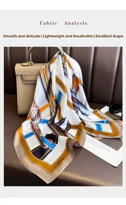 Detail of elegant geometric printed silk scarf tied on a luxury leather handbag