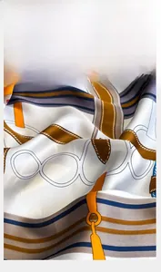 Close-up of the precision-stitched edges and elegant belt print on a silky scarf