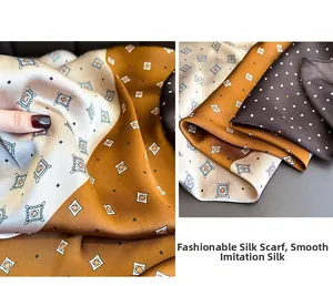 Detail of faux silk scarf showing silky texture and geometric polka dot print