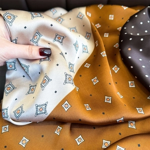 Silky square scarf with geometric patterns in caramel and brown satin finish