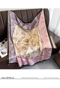 Detail of 90x90cm floral faux silk scarf with tulip patterns on a leather sofa