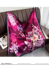 Detail view of 90x90cm floral silk scarf with peony print on a leather background