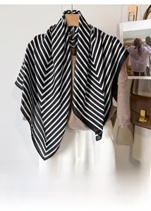 Classic black and white striped silk satin square scarf styled as a chic shoulder shawl