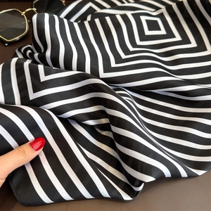 Classic black and white geometric striped satin square scarf with trendy sunglasses
