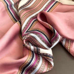 Pink faux silk scarf with geometric stripe patterns and smooth satin luster finish