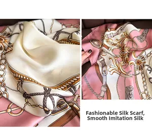 Detail of silk-like satin scarf featuring gold chain patterns and elegant soft pink drapes