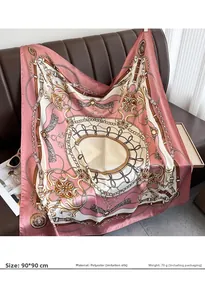 Detail of 90x90cm satin square scarf with chain patterns draped on a leather sofa