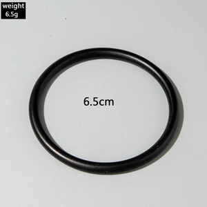 Detail view of a 6.5cm black acrylic bangle weighing 6.5g with a minimalist geometric design