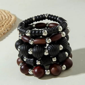 Stacked acrylic beaded bracelets with black matte and dark brown wooden textured beads