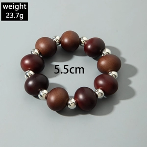Brown wooden bead bracelet with silver spacers, weight 23.7g and 5.5cm inner diameter