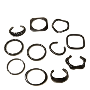 Minimalist matte black acrylic resin bracelet set with geometric and wavy patterns