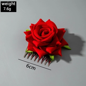 Detail view of 6cm red flocked rose hair comb weighing 7.6g with silver metal teeth