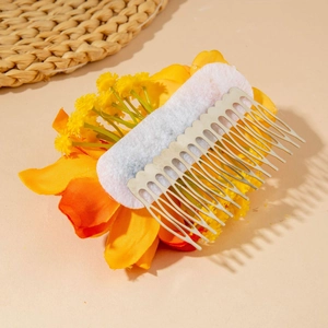 Detailed back view of orange bohemian floral hair comb showing sturdy metal teeth