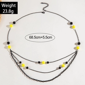 Detail van meerlaagse kralenketting met gele accenten, lengte 68,5 cm en gewicht 23,8 g
