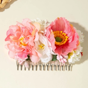 Close-up of handmade floral hair comb with pink peony and white daisies