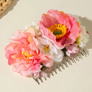 Detail of pink silk flowers and beaded fringe on a handmade bohemian hair comb