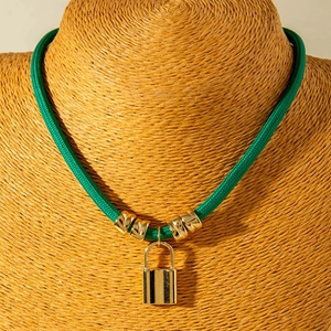 Fashionable dark green woven cord necklace with gold beads and a polished padlock pendant