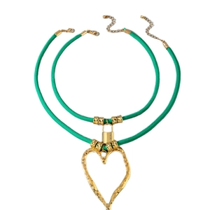 Green cord layered necklace with a molten gold heart pendant and lock charm detail