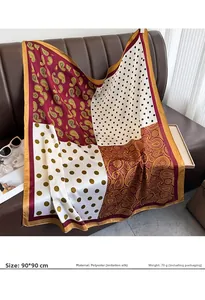 Detail of 90x90cm silk-feel scarf with paisley and polka dot patchwork on leather