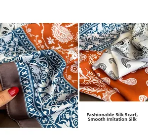 Detailed close-up showing soft satin paisley printed silk scarf with floral patterns