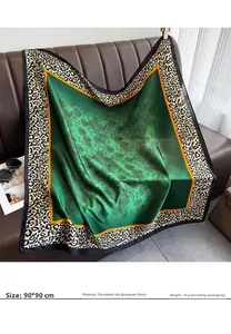 Detailed texture of 90x90cm satin square scarf with green floral and leopard print