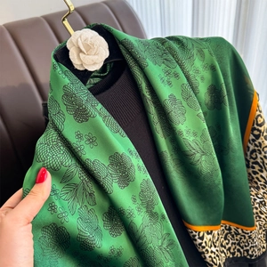 Satin silk scarf featuring vintage floral patterns and leopard print borders with brooch