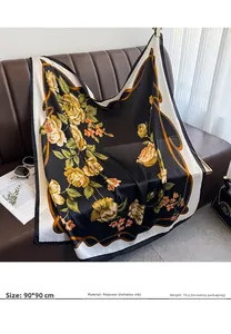 Macro detail of 90x90cm faux silk scarf featuring yellow roses on a black background