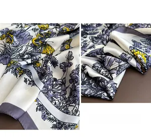 Detailed macro of a silk-like scarf with purple flowers and yellow butterfly prints