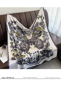 Close-up of 90x90cm silk-like scarf featuring purple butterfly prints on creamy base