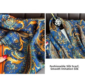 Detailed close-up of silky faux silk scarf featuring vintage blue paisley patterns