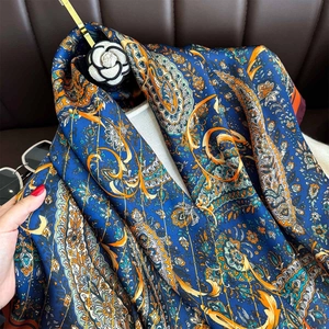 Luxurious blue paisley silk scarf shawl with elegant floral patterns and a smooth finish
