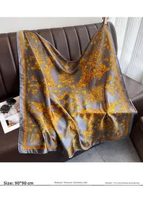 Baroque style silk-like scarf with gold pattern draped on leather sofa, size 90x90cm