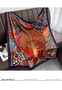 Detail of 90x90cm vintage silk scarf with tree of life print on a leather sofa