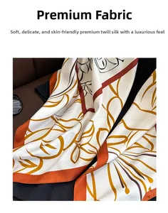 Close-up of premium twill silk scarf showing soft texture and floral print patterns