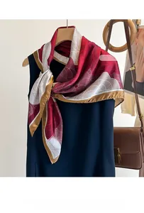 Detail of red and white printed silk scarf with golden piping drape and texture