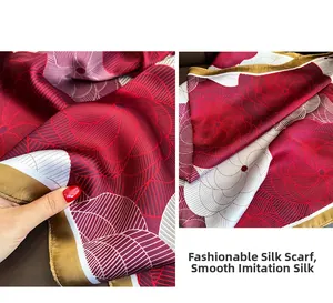 Detail of silk-like printed square scarf showing soft texture and floral patterns