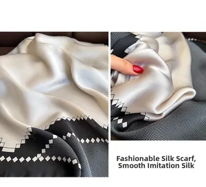 Detail of silk-like satin square scarf with wave patterns and polka dot matrix texture