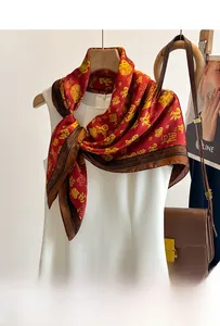 Close-up of red silk scarf with golden Chinese Fu character and traditional patterns