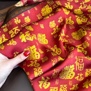 Red silk square scarf with golden Fu characters pattern and glossy satin finish