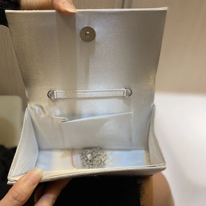 Silver glitter evening clutch bag with satin lining and detachable chain strap for parties