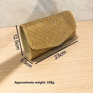Detail of the glittering gold crystal sequins and metallic finish on this evening clutch bag