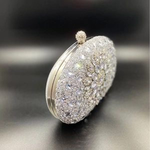 Elegant shell-shaped evening clutch bag with sparkling crystals and silver rhinestones