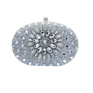 Sparkling silver shell-shaped evening bag with crystal floral pattern and top clasp