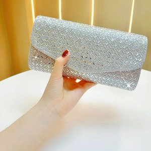 Detailed view of luxury silver rhinestone evening clutch bag with sparkling diamond texture