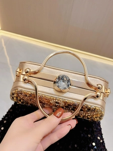 Luxury gold evening clutch with large crystal accent and sparkling gradient sequins